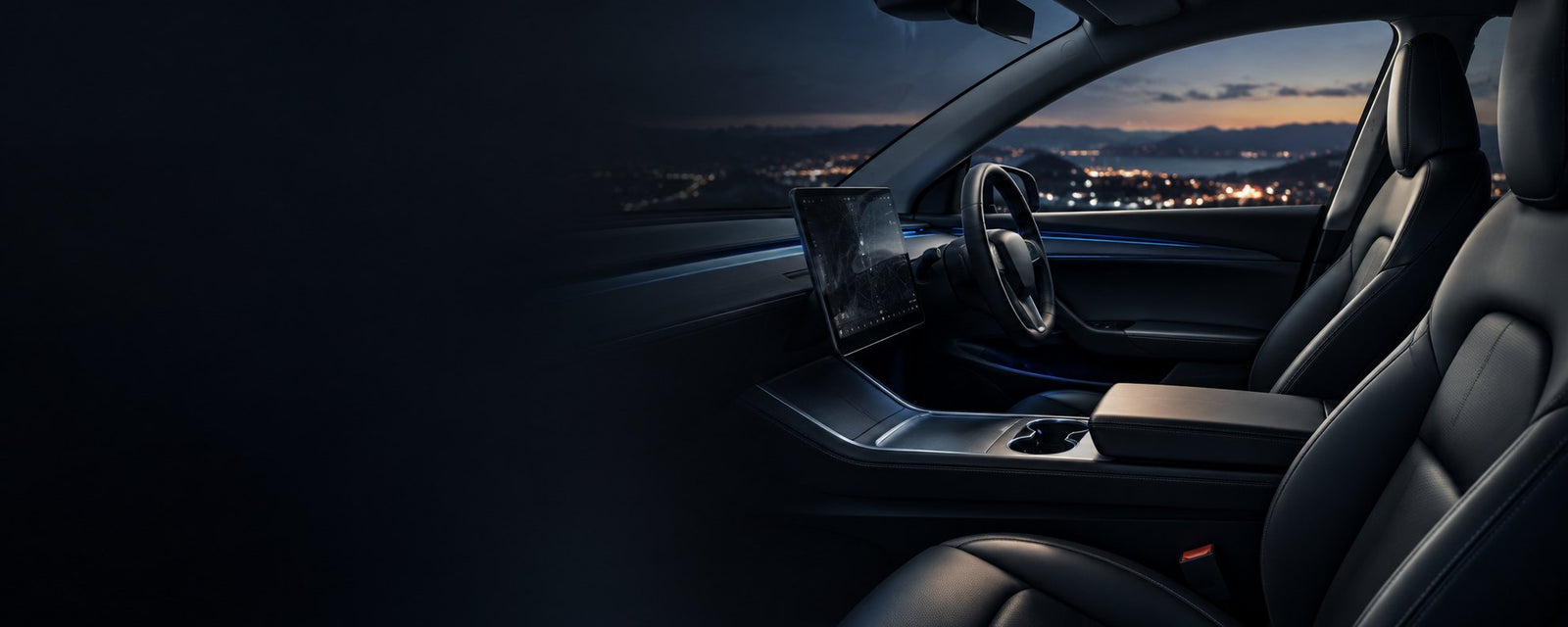 Tesla interior at dusk with the center screen glowing and city lights outside