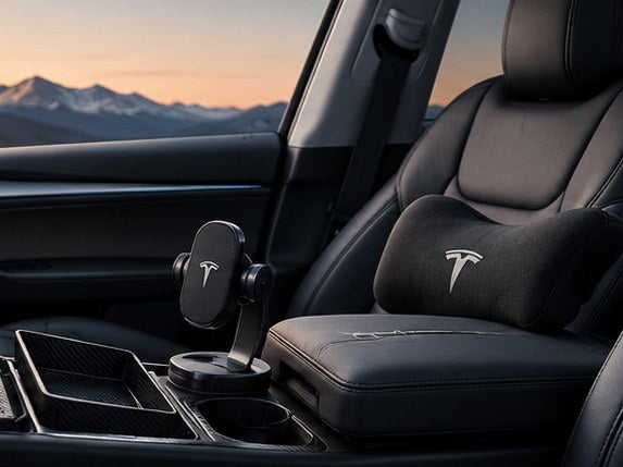Tesla front interior with a phone mount and console organizer at sunset